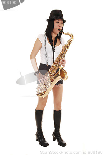 Image of Chinese girl playing the saxophone.