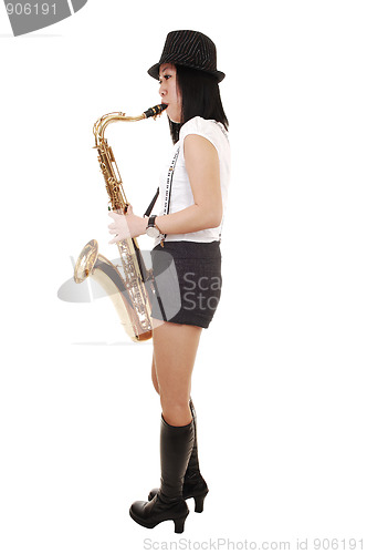 Image of Chinese girl playing the saxophone.