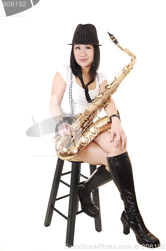 Image of Chinese girl playing the saxophone.