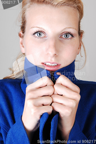 Image of Pretty lady in blue coat.