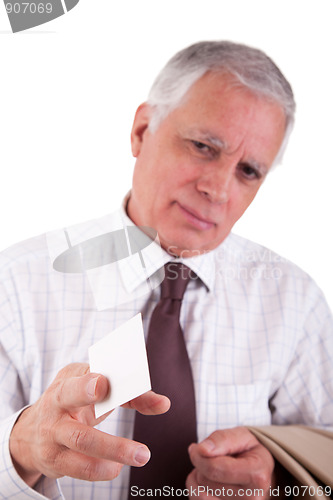 Image of Portrait of a mature  businessman, with blank business card in hand