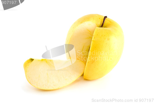 Image of Yellow apple with piece cut