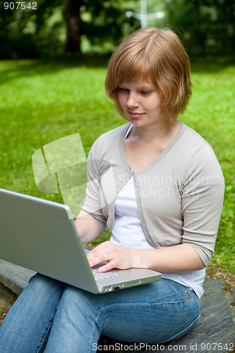 Image of Young female with laptop