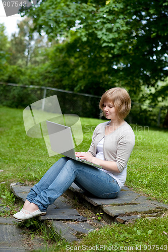 Image of Young female with laptop