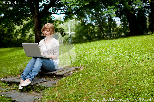 Image of Young female with laptop