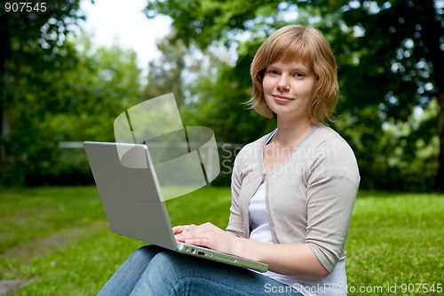 Image of Young female with laptop