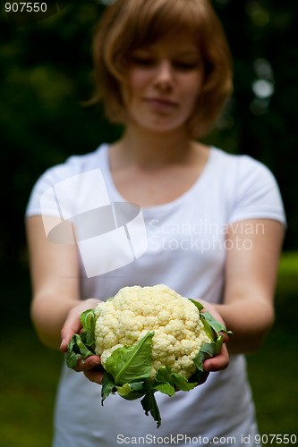 Image of Girl holding a fresh cauliflower