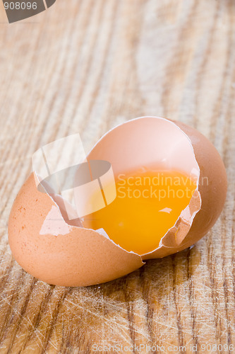 Image of broken brown egg