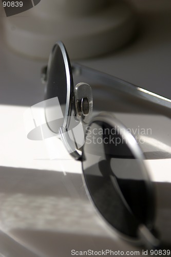 Image of Sunglasses on table in sunlight