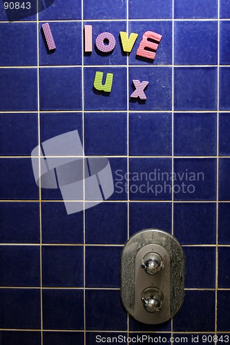 Image of I Love You message written on shower using foam letters