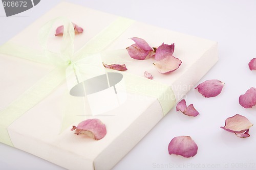 Image of present box with rose petals