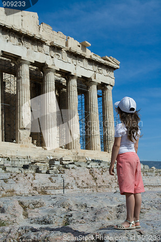 Image of Child in front of Ancient Parthenon in Acropolis Athens Greece
