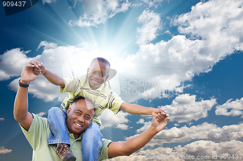 Image of Happy African American Man with Child Over Clouds and Sky