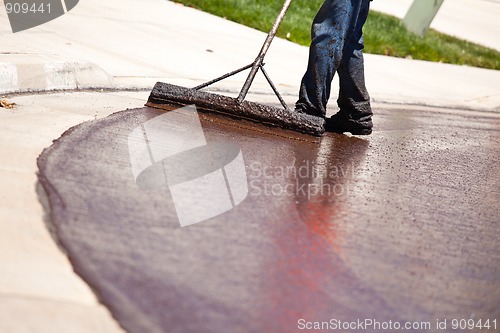 Image of Road Worker Resurfacing Street