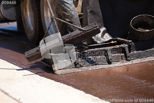 Image of Road Worker Resurfacing Street