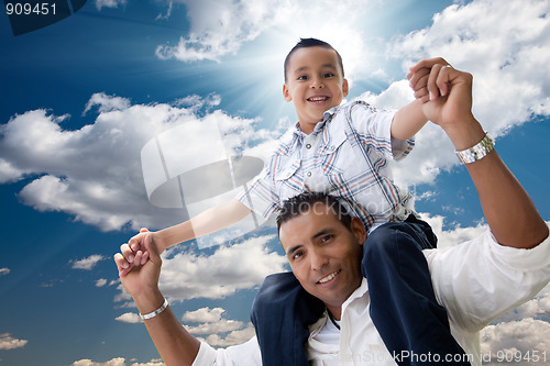 Image of Hispanic Father and Son Having Fun Over Clouds