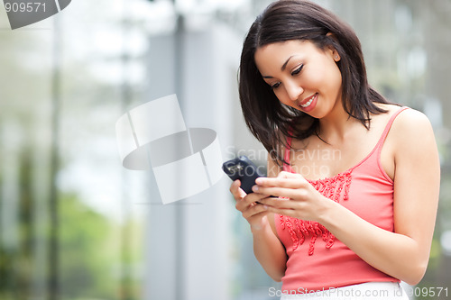 Image of Woman texting
