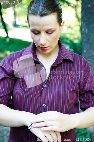 Image of Beautiful young woman with bracelet