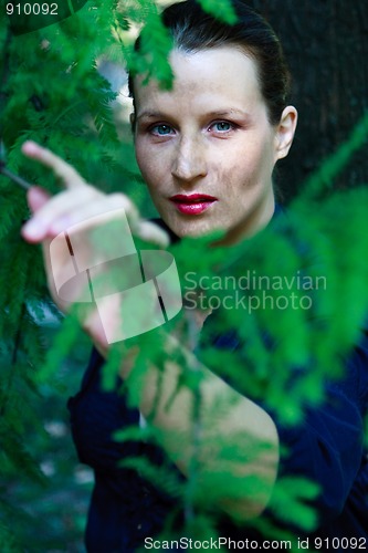 Image of Beautiful young woman in nature