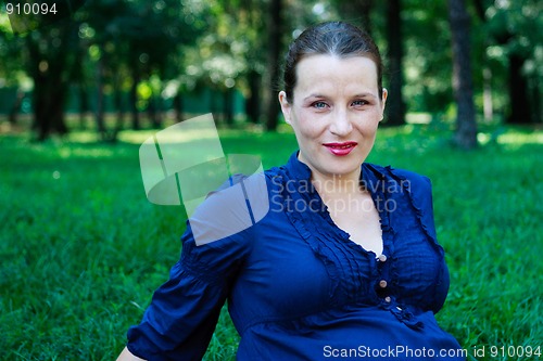 Image of Beautiful young woman in nature