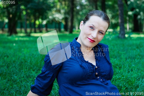 Image of Beautiful young woman in nature