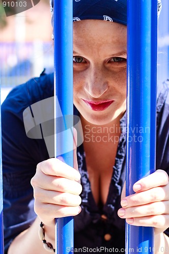 Image of Beautiful young woman with blue bars