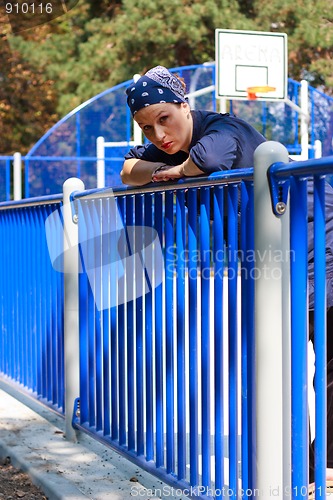 Image of Beautiful young woman on a basketball field