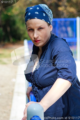 Image of Beautiful young woman dressed in blue