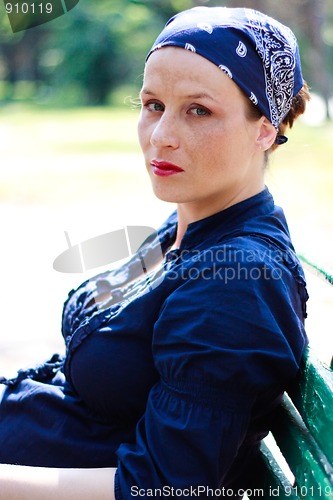 Image of Beautiful young pregnant woman resting