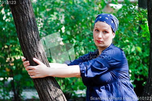 Image of Beautiful young woman in nature