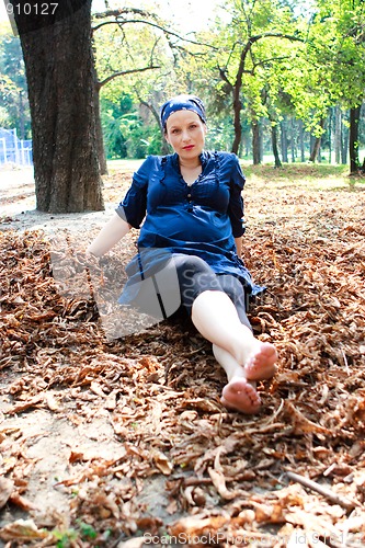 Image of Beautiful young pregnant woman in nature