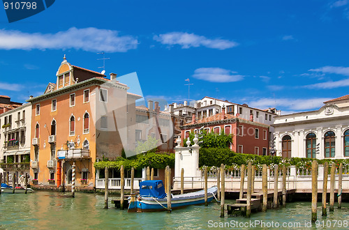 Image of Colofrul view of Venice canal with old buildings and piers 