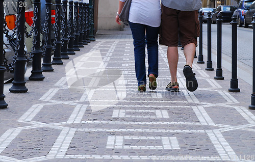 Image of couple walking on the street 