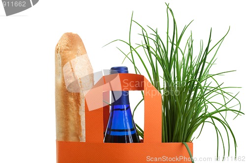 Image of shopping bag with bread, bottle and greenery