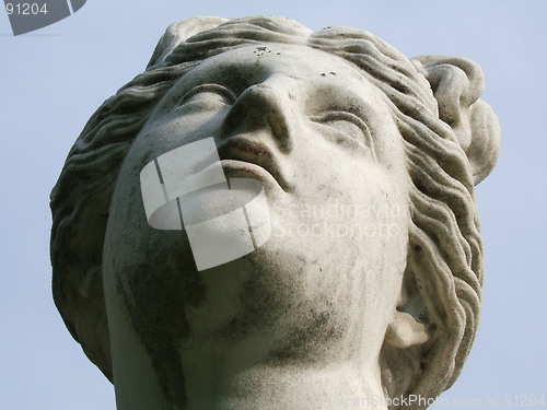 Image of Stone woman looking up