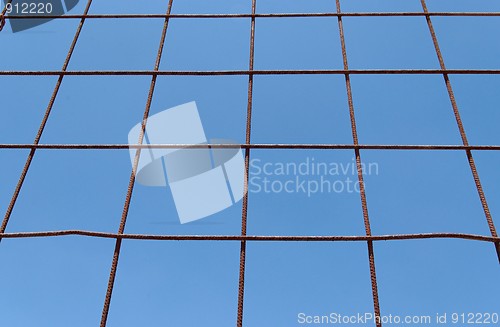 Image of Converging view of rusty lattice on sky background 