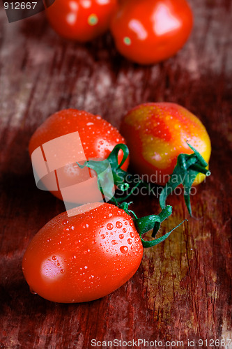 Image of tomatoes on wooden table