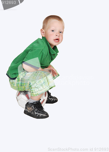 Image of Little boy with football.