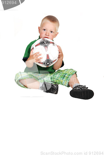 Image of Little boy with football.