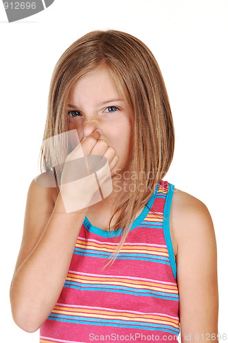 Image of Girl holds her nose closed.