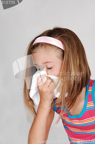 Image of Young girl sneezing.