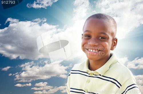 Image of Young African American Boy with Clouds and Sky