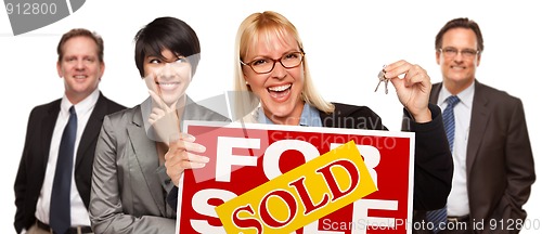 Image of Real Estate Team with Woman Holding Keys and Sold For Sale Sign