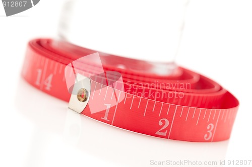 Image of Red Measuring Tape and Water Bottle on White