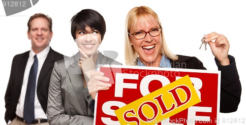 Image of Real Estate Team with Woman Holding Keys and Sold For Sale Sign