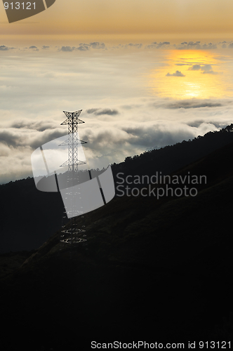 Image of Electricity pylon over valley at sunset, Lomba das Torres,  Madeira island, Portugal