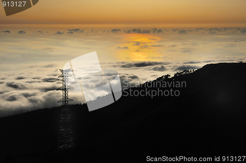 Image of Electricity pylon over valley at sunset, Lomba das Torres,  Madeira island, Portugal