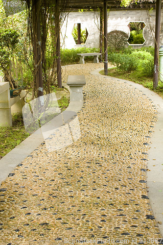 Image of Stone walkway winding in garden 