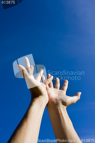 Image of Hand on sky,looking for help
