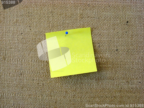 Image of Yellow note paper with pin